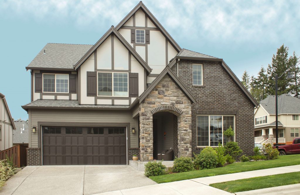 Large brown garage door installed for this home.