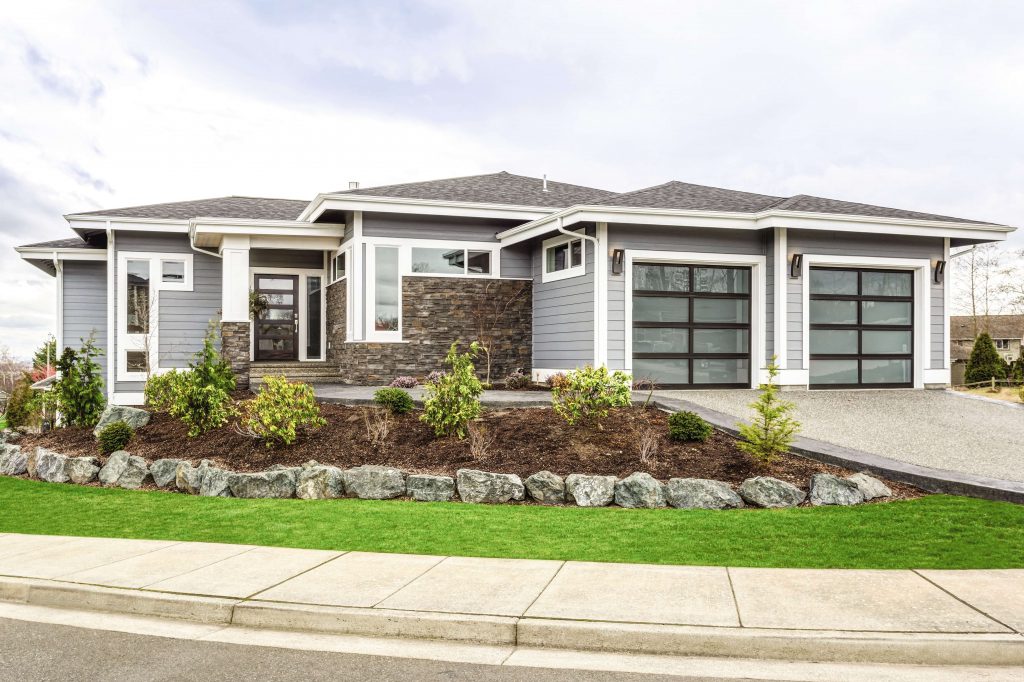 front of home with glass garage door