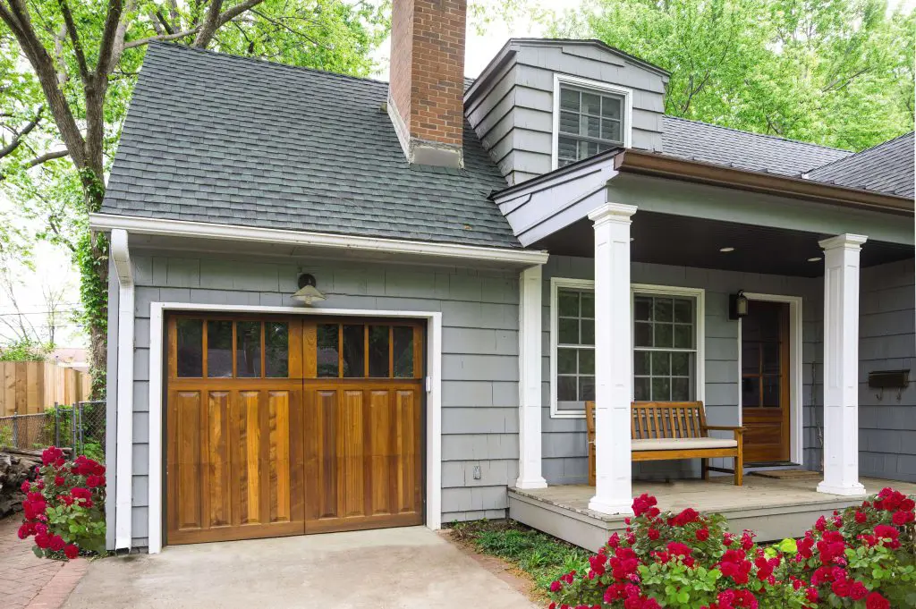 front of home featuring a wooden garage door