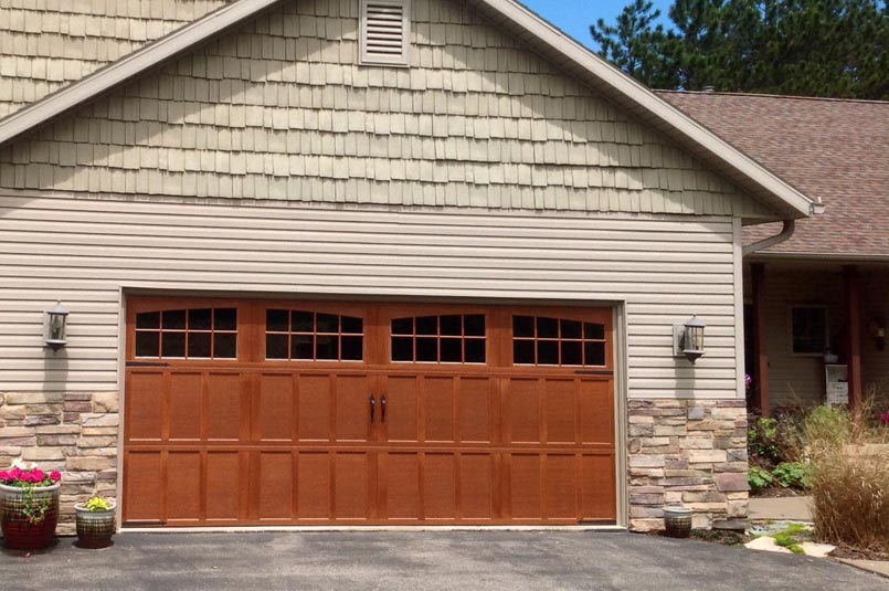 Carriage house garage door on home driveway