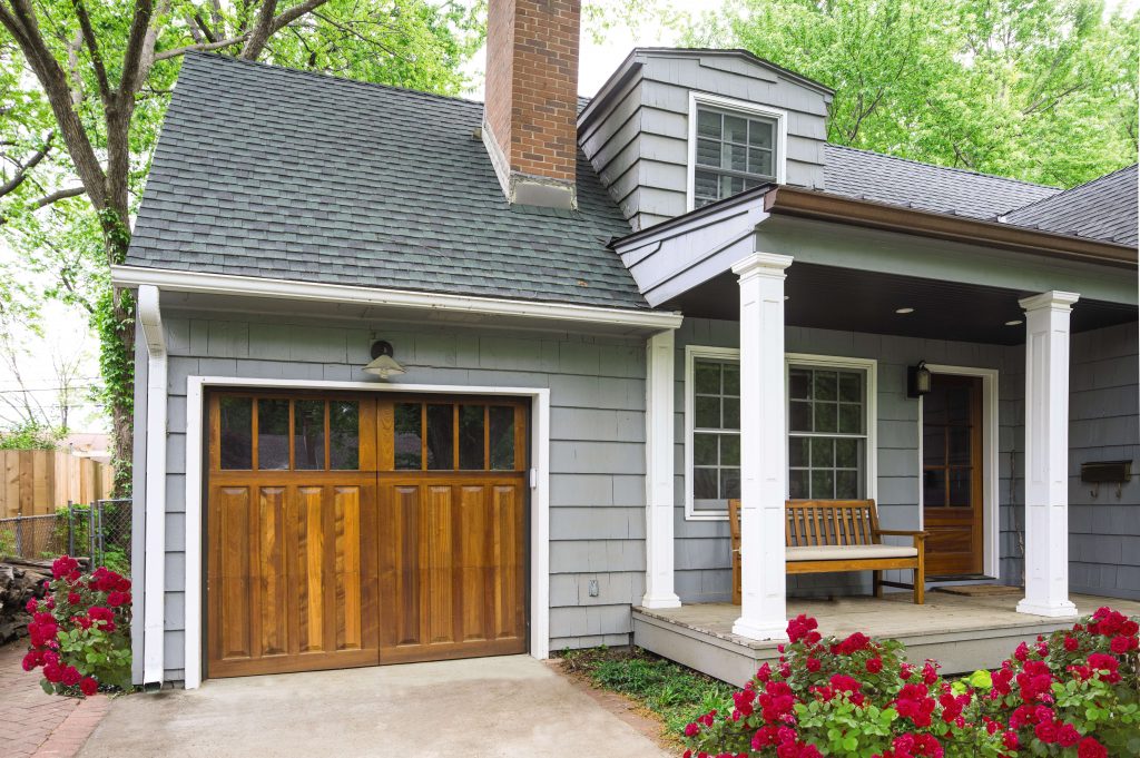 front of home featuring a wooden garage door